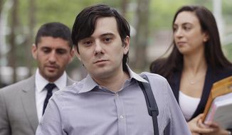 FILE - In this June 19, 2017, file photo, former Turing Pharmaceuticals CEO Martin Shkreli, center, arrives at Brooklyn federal court in New York with members of his legal team. Federal authorities are investigating claims that Shkreli has been running his pharmaceutical company from behind bars. The U.S. Bureau of Prisons said Friday, March 8, 2019, that it has opened an inquiry into whether the so-called &amp;quot;Pharma Bro&amp;quot; used a contraband smartphone inside a federal prison in New jersey. (AP Photo/Mark Lennihan, File)