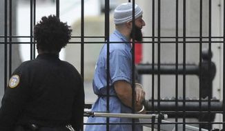 FILE - In this Feb. 3, 2016 file photo, Adnan Syed enters Courthouse East in Baltimore prior to a hearing. Maryland’s highest court has denied a new trial for Syed whose murder conviction was chronicled in the hit podcast “Serial.” In an opinion Friday, March 8, 2019, the Court of Appeals agreed with a lower court that Syed&#39;s legal counsel was deficient in failing to investigate an alibi witness, but it disagreed that the deficiency prejudiced the case. The court says Syed waived his ineffective counsel claim. (Barbara Haddock Taylor/The Baltimore Sun via AP, File)