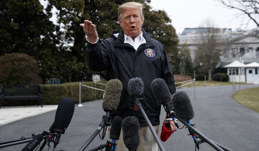 President Donald Trump talks with reporters outside the White House before traveling to Alabama to visit areas affected by the deadly tornadoes, Friday, March 8, 2019, in Washington. (AP Photo/ Evan Vucci)