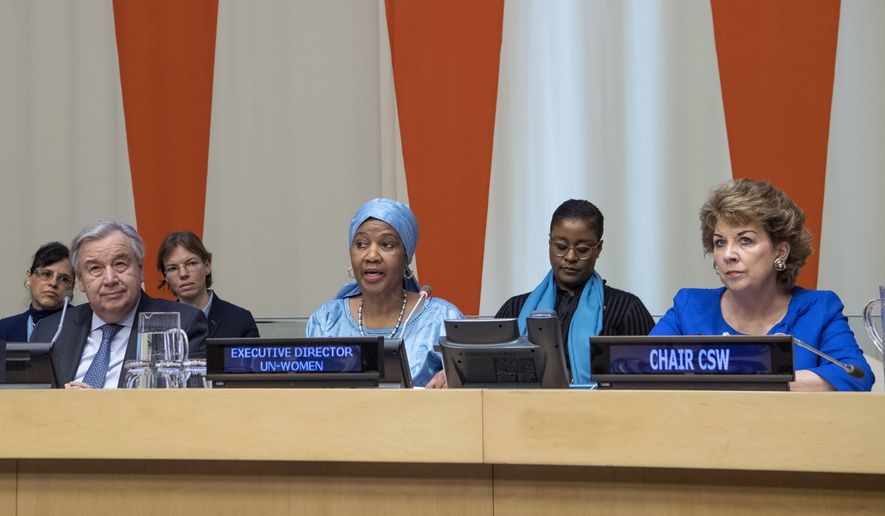 In this Friday, March 8, 2019 photo provided by the United Nations, Phumzile Mlambo-Ngcuka, third from right, executive director of UN Women, speaks at the United Nations Observance of International Women&#x27;s Day at the United Nations headquarters. Mlambo-Ngcuka is calling for the revolution in technology to be used to benefit the world&#x27;s poor and especially women who will not achieve gender equality without &quot;the giant leap that 21st century innovations can bring.&quot; At left is U.N. secretary General Antonio Guterres, and at right is Geraldine Byrne-Nason, chair of the Commission on the Status of Women and Permanent Representative of Ireland to the United Nations. (Eskinder Debebe/The United Nations via AP) **FILE**
