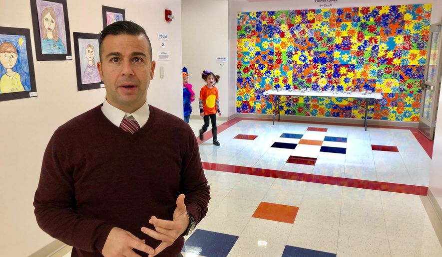 New Berlin Schools Superintendent Adam Ehrman discusses the benefits of the school district's $14.5 million elementary school built in 2009 in this Friday, March 1, 2019 photo. The district built the school with the promise of a $5 million state contribution from the 20-year-old school construction grant program. But the program hasn't been funded for a decade and New Berlin's wait for the state subsidy hampers the district's effort to fix the problems of a crowded, outdated junior-senior high school. As new Illinois Gov. J.B. Pritzker pushes for approval of a multibillion, statewide capital construction program, public school officials press for funding the grant program, which has a 15-year waiting list of 285 projects seeking state-subsidy approval. (AP Photo/John O'Connor)