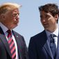 In this June 8, 2018, photo, President Donald Trump talks with Canadian Prime Minister Justin Trudeau during a G-7 Summit welcome ceremony in Charlevoix, Canada. Trump has been engulfed in allegations involving possible collusion with Russia and secret payments to buy the silence of a porn star. Trudeau is facing a controversy that seems trivial by comparison, but it could topple him in elections later this year. (AP Photo/Evan Vucci) **FILE**