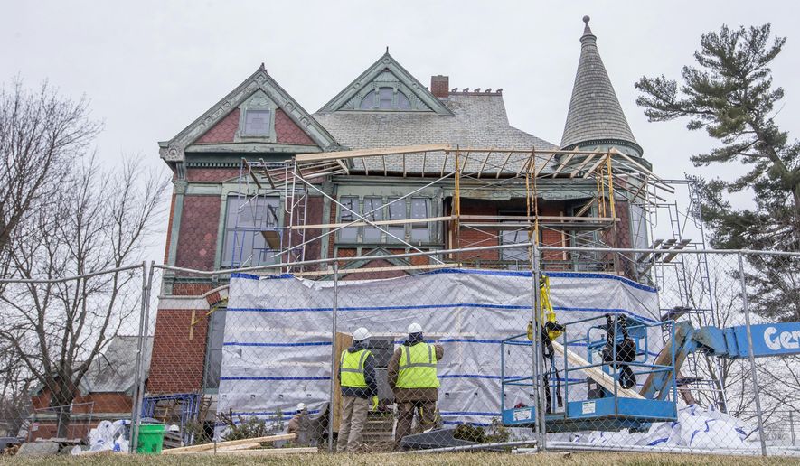 In a Wednesday, Feb. 27, 2019 photo, scaffolding is built around the Henry A. Chapin House, also known as Chapin Mansion, while work is done on the historic home, in Niles, Mich. (Robert Franklin/South Bend Tribune via AP)