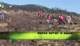 In this image taken from video, rescuers search through wreckage at the scene of an Ethiopian Airlines flight that crashed shortly after takeoff at Hejere near Bishoftu, or Debre Zeit, some 50 kilometers (31 miles) south of Addis Ababa, in Ethiopia Sunday, March 10, 2019. The Ethiopian Airlines flight crashed shortly after takeoff from Ethiopia&#39;s capital on Sunday morning, killing all 157 on board, authorities said, as grieving families rushed to airports in Addis Ababa and the destination, Nairobi. (AP Photo/Yidnek Kirubel)