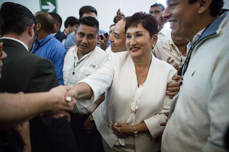 Thelma Aldana, Guatemala's former chief prosecutor, greets supporters during her campaign event for president in Guatemala City, Sunday, March 10, 2019. Aldana is a candidate with The Seed Movement party ahead of June 16 presidential elections. (AP Photo/Oliver de Ros)