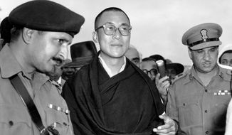 FILE -  In this April 18, 1959, file photo, Tibetan spiritual leader the Dalai Lama, center,  arrives at Tezpur, Assam in India. Tibetan activists put up posters and hoisted a Tibetan flag in India&#x27;s capital New Delhi on Sunday, March 10, 2019, to mark the 60th anniversary of 1959 uprising against Chinese rule. (AP Photo, File)