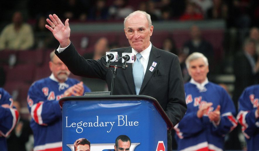 FILE - In this Sunday, Feb. 22, 2009 file photo, Harry Howell waves to the crowd during a ceremony to retire his number before the Ranger's hockey game at Madison Square Garden in New York. NHL Hall of Fame defenseman Harry Howell, who played the most games in the history of New York Rangers, has died. He was 86. Howell died Saturday night, March 9, 2019. Howell played 1,160 games for the Rangers from 1952-69 and had his No. 3 retired by the team. (AP Photo/Seth Wenig, File)
