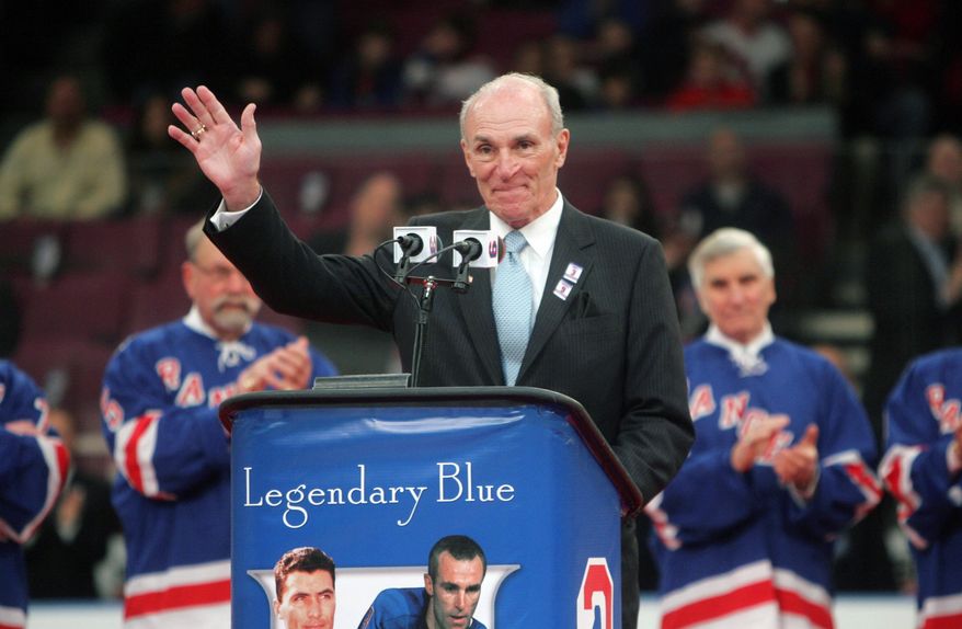 FILE - In this Sunday, Feb. 22, 2009 file photo, Harry Howell waves to the crowd during a ceremony to retire his number before the Ranger's hockey game at Madison Square Garden in New York. NHL Hall of Fame defenseman Harry Howell, who played the most games in the history of New York Rangers, has died. He was 86. Howell died Saturday night, March 9, 2019. Howell played 1,160 games for the Rangers from 1952-69 and had his No. 3 retired by the team. (AP Photo/Seth Wenig, File)