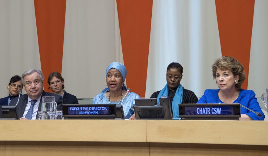 In this Friday, March 8, 2019 photo provided by the United Nations, Phumzile Mlambo-Ngcuka, third from right, executive director of UN Women, speaks at the United Nations Observance of International Women's Day at the United Nations headquarters. Mlambo-Ngcuka is calling for the revolution in technology to be used to benefit the world's poor and especially women who will not achieve gender equality without "the giant leap that 21st century innovations can bring." At left is U.N. secretary General Antonio Guterres, and at right is Geraldine Byrne-Nason, chair of the Commission on the Status of Women and Permanent Representative of Ireland to the United Nations. (Eskinder Debebe/The United Nations via AP)