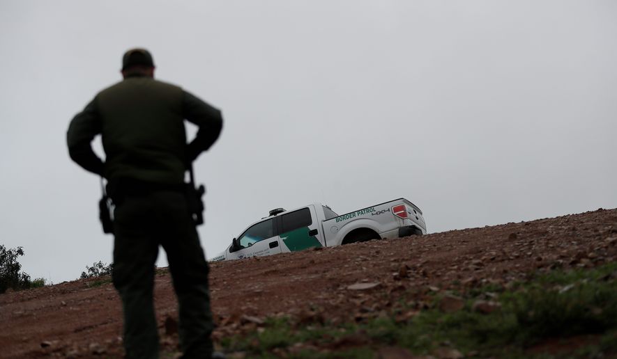 &quot;Hundreds of man hours are wasted each day at a time of crisis on the border,&quot; said the leaders of the National ICE Council in a letter.
Border Patrol agent Vincent Pirro looks on near where a border wall ends that separates the cities of Tijuana, Mexico, and San Diego, Tuesday, Feb. 5, 2019, in San Diego. President Donald Trump is expected to speak about funding for a wall along the U.S.-Mexico border during his State of the Union address Tuesday. (AP Photo/Gregory Bull) (Associated Press)