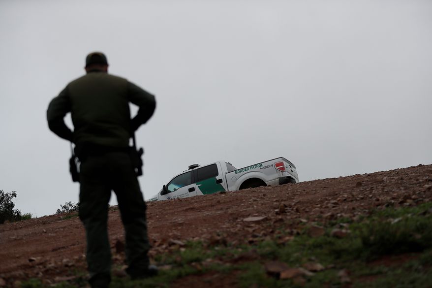 "Hundreds of man hours are wasted each day at a time of crisis on the border," said the leaders of the National ICE Council in a letter.
Border Patrol agent Vincent Pirro looks on near where a border wall ends that separates the cities of Tijuana, Mexico, and San Diego, Tuesday, Feb. 5, 2019, in San Diego. President Donald Trump is expected to speak about funding for a wall along the U.S.-Mexico border during his State of the Union address Tuesday. (AP Photo/Gregory Bull) (Associated Press)