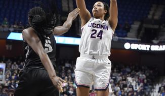 Connecticut&#x27;s Napheesa Collier (24) shoots over Central Florida&#x27;s Masseny Kaba (5) during the first half of an NCAA college basketball game in the American Athletic Conference women&#x27;s tournament finals, Monday, March 11, 2019, at Mohegan Sun Arena in Uncasville, Conn. (AP Photo/Jessica Hill)