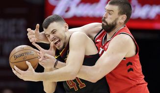 Toronto Raptors&#39; Marc Gasol, right, from Spain, battles with Cleveland Cavaliers&#39; Ante Zizic (41), from Croatia, for the ball in the second half of an NBA basketball game, Monday, March 11, 2019, in Cleveland. Gasol was called for a foul. The Cavaliers won 126-101. (AP Photo/Tony Dejak)