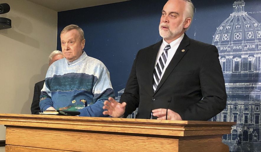 Minnesota State Reps. Gene Pelowski, D-Winona, left, and Tony Albright, R-Prior Lake, discuss legislation to replenish a disaster aid fund ahead of anticipated spring flooding during a news conference at the state Capitol in St. Paul, Minn., Monday, March 11, 2019. Lawmakers are pushing to replenish a nearly empty disaster fund ahead of anticipated spring flooding. Republican lawmakers at a news conference highlighted a proposal for $40 million to refill the depleted fund. But House Democrat Pelowski, says it's meant for disasters between legislative sessions. If there is serious flooding this spring, Pelowski says, the Legislature would approve aid while it's still in session. (AP Photo/Steve Karnowski)