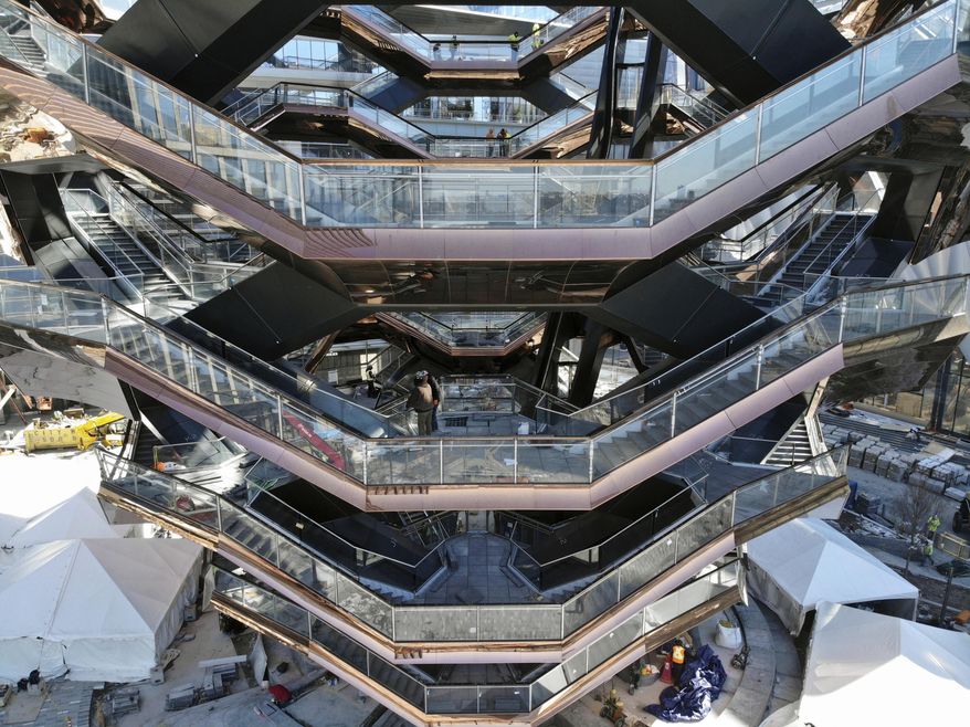 This March 5, 2019, photo taken with a drone shows "Vessel," a 150-foot-tall structure of climbable interlocking staircases, that is the center point of the $25 billion Hudson Yards Redevelopment in New York. The climbable structure opens to the public on Friday. (AP Photo/Ted Shaffrey)