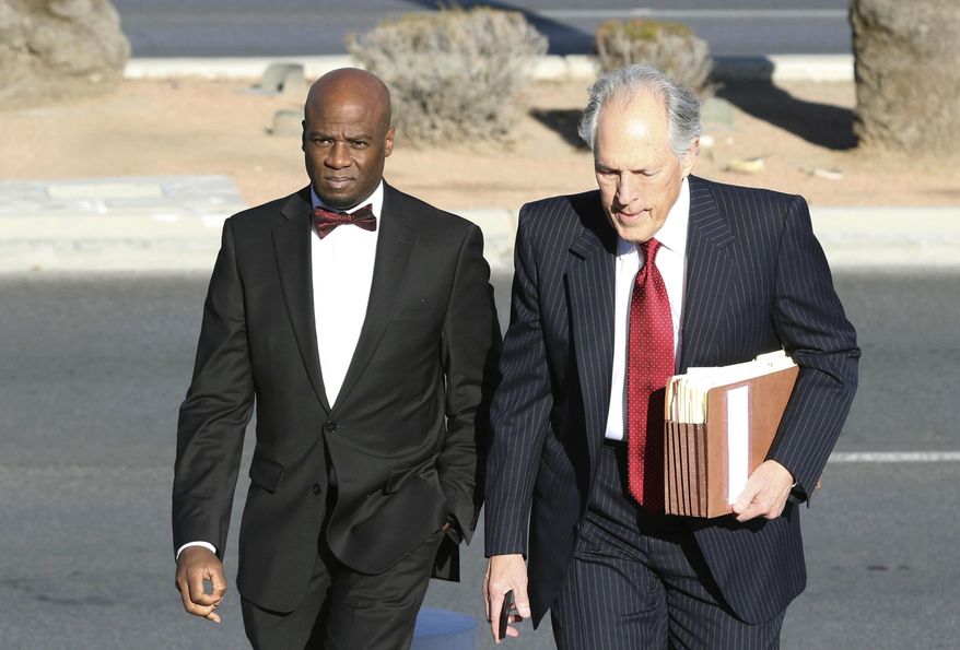 Former Nevada Senate Majority Leader Kelvin Atkinson, left, and his attorney Richard Wright arrive at the Lloyd George U.S. Courthouse on Monday, March 11, 2019, in Las Vegas. Atkinson pleaded guilty to wire fraud after admitting to taking about $250,000 in campaign funds to lease a luxury SUV, open a Las Vegas night club and other personal expenses. (Bizuayehu Tesfaye/Las Vegas Review-Journal via AP)