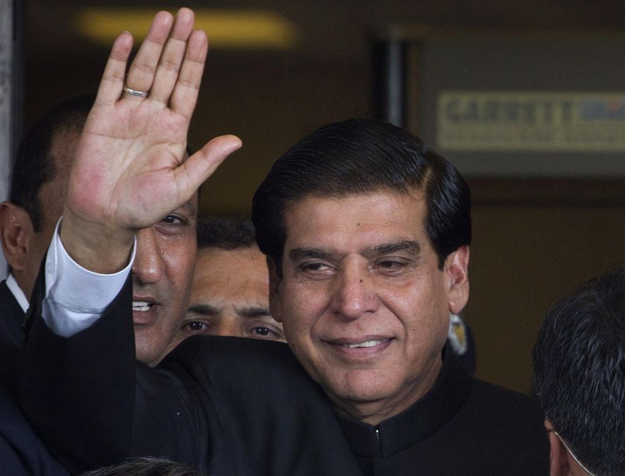 FILE - In this Aug. 27, 2012 file photo, Pakistan's former Prime Minister Raja Pervaiz Ashraf waves in Islamabad, Pakistan. On Monday, March 11, 2019, a Pakistani anti-graft tribunal indicted Ashraf and six others over charges of causing millions of dollar loss to national exchequer because of delay in executing a power project. (AP Photo/Anjum Naveed, File)