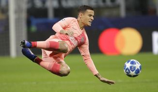FILE - In this file photo dated Tuesday, Nov. 6, 2018, Barcelona&#39;s Philippe Coutinho controls the ball during the Champions League group B soccer match against Inter Milan at the San Siro stadium in Milan, Italy.  More than a year after arriving as one of Barcelona’s most expensive signings, Brazilian midfielder Philippe Coutinho is still struggling to play up to expectations. (AP Photo/Luca Bruno, FILE)