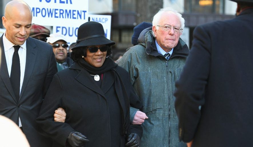 Sen. Bernard Sanders is campaigning early in South Carolina, particularly among black voters who make up a major part of the base of the Democratic Party. Sen. Cory A. Booker, (left), is also putting an early focus on black voters in South Carolina. Mr. Sanders lost the state in 2016 by 47 percentage points. (Associated Press photographs)