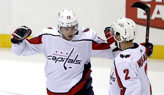Washington Capitals&#39; Jakub Vrana (13) celebrate his goal with Matt Niskanen during the first period of an NHL hockey game against the Pittsburgh Penguins in Pittsburgh, Tuesday, March 12, 2019. (AP Photo/Gene J. Puskar) ** FILE **