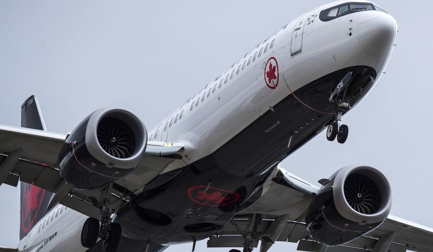 An Air Canada Boeing 737 Max 8 aircraft arriving from Toronto prepares to land at Vancouver International Airport, in Richmond, British Columbia on Tuesday, March 12, 2019. Canadian Transport Minister Marc Garneau says &quot;all options are on the table&quot; with regard to the country&#x27;s fleet of Boeing 737 Max 8 aircraft but says the government currently has no plans to order the grounding of the plane. (Darryl Dyck/The Canadian Press via AP)