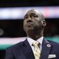 Wake Forest head coach Danny Manning looks up at a video scoreboard during the first half of an NCAA college basketball game against Miami in the Atlantic Coast Conference tournament in Charlotte, N.C., Tuesday, March 12, 2019. (AP Photo/Chuck Burton)