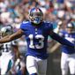 FILE - In this Oct. 7, 2018, file photo, New York Giants&#39; Odell Beckham Jr. celebrates a catch against the Carolina Panthers during the first half of an NFL football game in Charlotte, N.C. Two people familiar with the blockbuster trade say the Cleveland Browns have agreed to acquire Beckham from the Giants. (AP Photo/Jason E. Miczek, File)