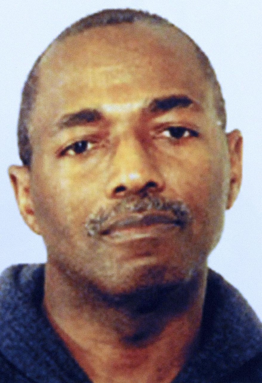 A July 2013 photo shows a photo of former Chicago police officer Eddie Hicks. Hicks is scheduled to go on trial in Chicago federal court Monday, March 4, 2019 for federal drug and conspiracy charges more than 15 years after he fled and went on the run. Hicks has been held without bond since his September 2017 arrest in Detroit. (FBI/Chicago Sun-Times via AP)