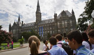 In this July 10, 2013, file photo, prospective students tour Georgetown University&#39;s campus in Washington. (AP Photo/Jacquelyn Martin) ** FILE **