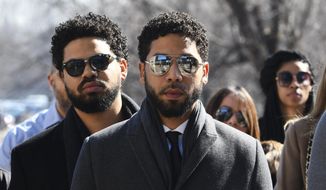 &amp;quot;Empire&amp;quot; actor Jussie Smollett, center, arrives at Leighton Criminal Court Building for a hearing to discuss whether cameras will be allowed in the courtroom during his disorderly conduct case on Tuesday, March 12, 2019, in Chicago. A grand jury indicted Smollett last week on 16 felony counts accusing him of lying to the police about being the victim of a racist and homophobic attack by two masked men in downtown Chicago.(AP Photo/Matt Marton)
