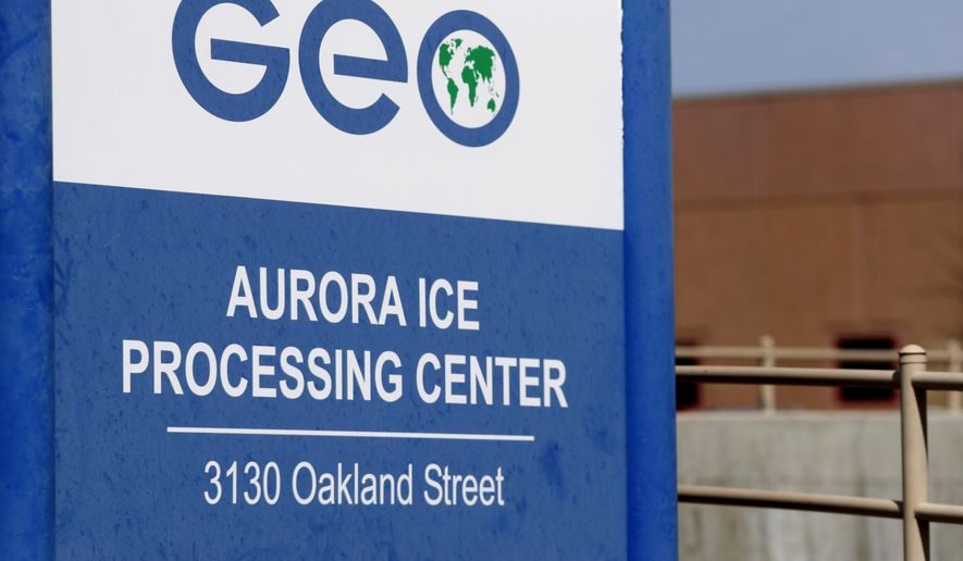 FILE - This April 15, 2017, file photo, shows the entrance to the GEO Group's immigrant detention facility in Aurora, Colo. U.S. immigration authorities say more than 2,200 people exposed to a mumps outbreak in at least two detention facilities have been quarantined. Immigration and Customs Enforcement said Tuesday, March 12, 2019, that the quarantine began March 7 at facilities in Pine Prairie, Louisiana, and Aurora, Colorado. (AP Photo/David Zalubowski, File)
