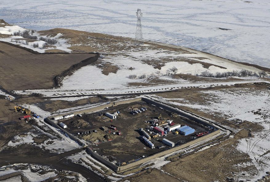 FILE - This Feb. 13, 2017, aerial file photo shows a site where the final phase of the Dakota Access Pipeline crosses beneath the Missouri River in North Dakota, just north of the Standing Rock Reservation in Emmons County in Cannon Ball, N.D. Federal officials who permitted the Dakota Access oil pipeline are turning over a few documents sought by American Indian tribes suing over the project. But they say a request for dozens more records is vague and overly broad and should be rejected by a federal judge. The pipeline developer also is asking the judge to deny the tribal request, saying it&#x27;s meritless and will cause needless delay in an already protracted legal fight. (Tom Stromme/The Bismarck Tribune via AP, File)