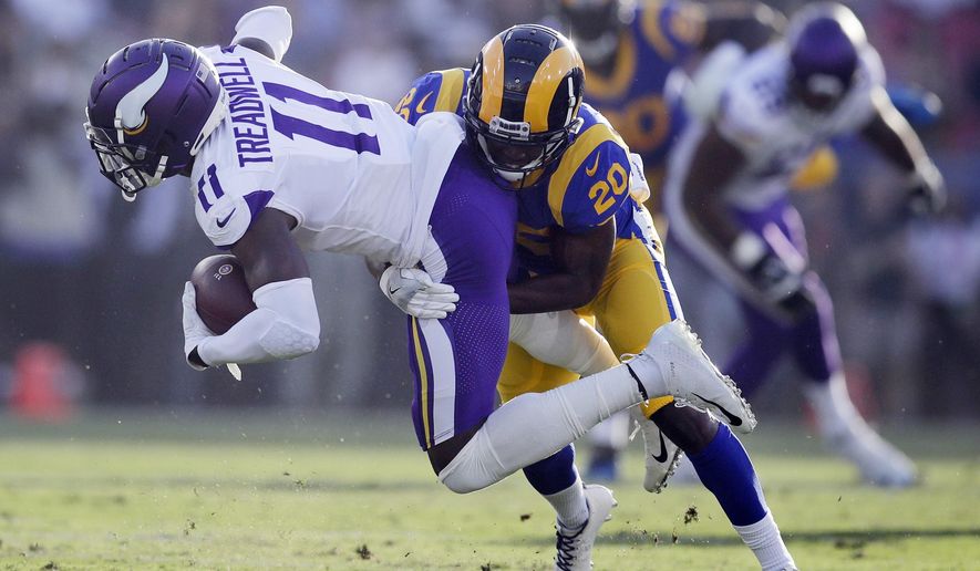 FILE - In this Sept. 27, 2018, file photo, Minnesota Vikings wide receiver Laquon Treadwell (11) is tackled by Los Angeles Rams defensive back Lamarcus Joyner during the first half in an NFL football game in Los Angeles. The Oakland Raiders have agreed to a four-year contract with free agent safety Lamarcus Joyner. A person familiar with the deal said Tuesday, March 12, 2019, on condition of anonymity, that Joyner will sign the contract after the start of the new league year. The person spoke on condition of anonymity because the move can't be finalized until Wednesday. (AP Photo/Jae C. Hong, File)