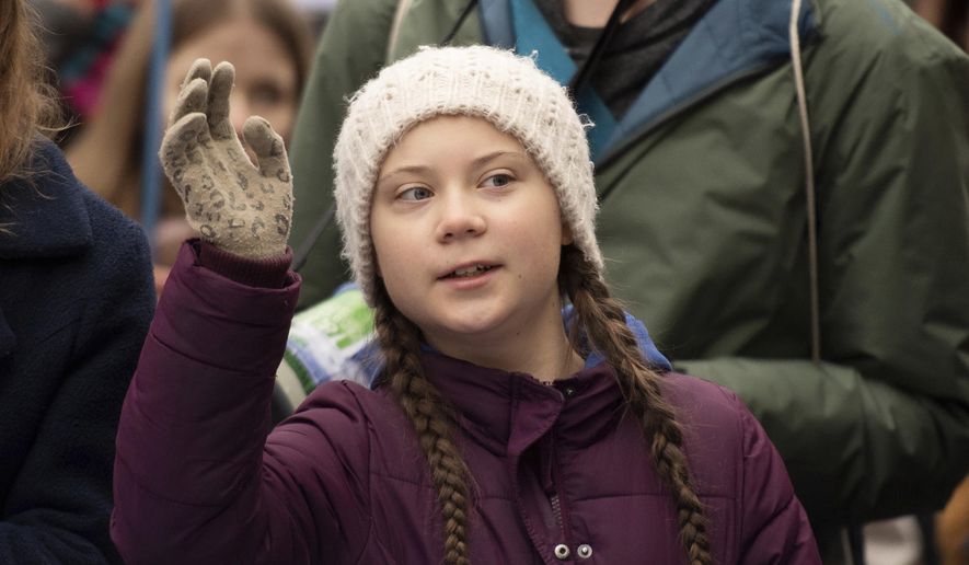 Swedish climate activist Greta Thunberg gestures as she attends a protest rally in Hamburg, Germany, Friday, March 1, 2019. (Daniel Reinhardt/dpa via AP)