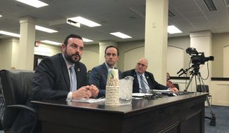 In this Monday, March 11, 2019 photo, Eastern Kentucky University Vice President David McFaddin, left, speaks to lawmakers about a proposal that would let the university and other quasi-governmental entities leave the state&#39;s struggling pension system, in Frankfort, Ky. Lawmakers are scheduled to approve a bill Wednesday, March 13 that would allow these agencies to leave the system without paying what they owe. It would make one of the country&#39;s worst-funded pension systems even more underfunded, but lawmakers say they have no choice because the agencies can&#39;t afford to pay higher pension contribution rates. (AP Photo/Adam Beam)