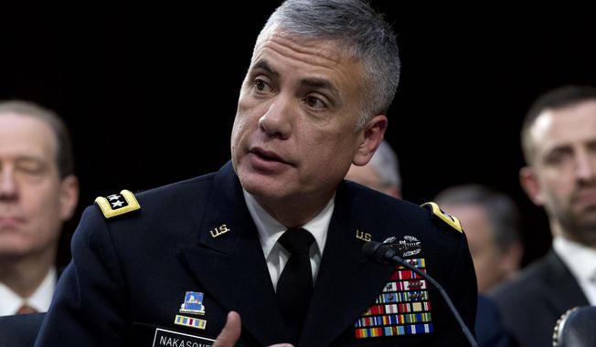 FILE - In this Jan. 29, 2019, file photo, National Security Agency director and head of U.S. Cyber Command Gen. Paul Nakasone testifies before the Senate Intelligence Committee on Capitol Hill in Washington. Nakasone says the military learned a lot as it worked with other government agencies to thwart Russian interference in the 2018 midterm elections. He says the focus has turned to the next election cycle. (AP Photo/Jose Luis Magana, File)