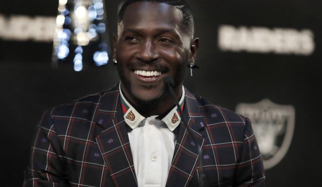 Oakland Raiders wide receiver Antonio Brown smiles during the NFL football team&#x27;s news conference Wednesday, March 13, 2019, in Alameda, Calif. (AP Photo/Ben Margot)