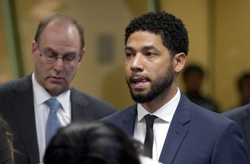 &quot;Empire&quot; actor Jussie Smollet, stands before Cook County Circuit Court Judge Steven Watkins where he pled not guilty at the Leighton Criminal Court Building, Thursday, March 14, 2019 in Chicago. Smollett pleaded not guilty Thursday to charges accusing him of lying to the police about being the victim of a racist and homophobic attack in downtown Chicago a few weeks ago. (E. Jason Wambsgans/Chicago Tribune via AP, Pool)