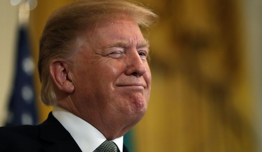 President Donald Trump winks during the annual presentation of a bowl of shamrocks with Irish Prime Minister Leo Varadkar, Thursday, March 14, 2019, in the East Room of the White House in Washington. (AP Photo/Jacquelyn Martin)