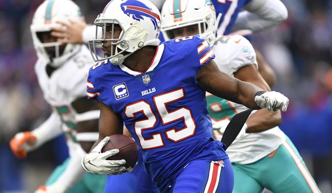 FILE - In this Dec. 30, 2018, file photo, Buffalo Bills running back LeSean McCoy (25) rushes against the Miami Dolphins during the first half of an NFL football game in Orchard Park, N.Y. Running back Frank Gore sees nothing funny about teaming up with McCoy in Buffalo to form the NFL&#x27;s oldest backfield. Instead, Gore sees no reason why the pair of 30-somethings can&#x27;t continue their lengthy run of dominance. (AP Photo/Adrian Kraus, File)