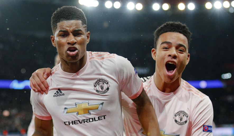 ManU&#39;s Marcus Rashford, left, celebrates after scoring his side&#39;s third goal during the Champions League round of 16, second leg soccer match between Paris Saint Germain and Manchester United at the Parc des Princes stadium in Paris, France, Wednesday, March. 6, 2019. (AP Photo/Francois Mori)