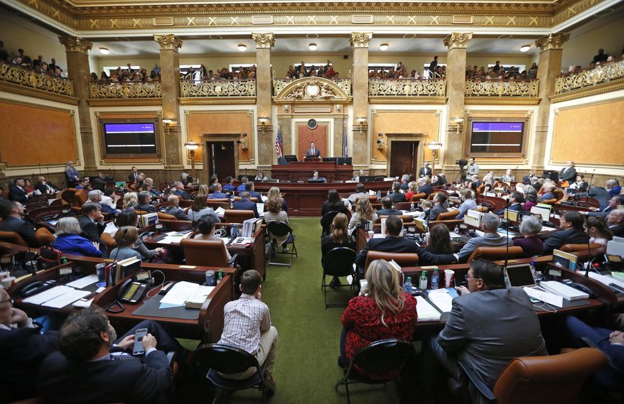 FILE - In this Jan. 28, 2019, file photo, the floor of the Utah House of Representatives is shown during the first day of the Utah legislative session, in Salt Lake City. Utah lawmakers were set Thursday, March 14, 2019, to end their annual legislative session after scaling back a voter-approved Medicaid expansion, passing a long-awaited update to the state's hate crimes law and reaching a deal to increase the alcohol level in beer. Measures on other hot-button issues failed to pass, like a ban on LGBT conversion therapy. Lawmakers also passed two anti-abortion measures. (AP Photo/Rick Bowmer, File)