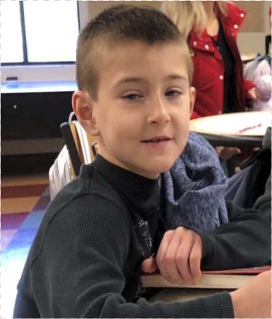 This undated photo provided by the Corona Police Department shows eight-year-old missing child, Noah McIntosh. Southern California authorities who are searching for the boy have arrested his father and mother. The Corona Police Department says the investigation began Tuesday, March 12, 2019, when officers spoke with the mother of McIntosh and unsuccessfully attempted to contact his father at a local apartment. (Corona Police Department via AP)