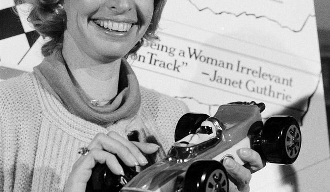 FILE - This April 6, 1978, file photo shows Janet Guthrie posing with a toy race car at a news conference in New York. Guthrie, the first woman to qualify and compete in both the Daytona 500 and the Indianapolis 500, was dropped from the list of nominees for NASCAR&#x27;s Landmark Award that honors contribution to the sport. (AP Photo/Marty Lederhandler, File)