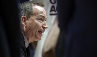 Texas A&amp;amp;M head coach Billy Kennedy talks with his players in the second half of an NCAA college basketball game against Vanderbilt at the Southeastern Conference tournament, Wednesday, March 13, 2019, in Nashville, Tenn. Texas A&amp;amp;M won 69-52. (AP Photo/Mark Humphrey)