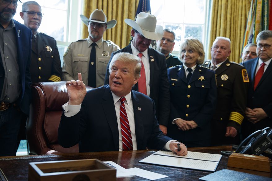 President Donald Trump speaks about border security in the Oval Office of the White House, Friday, March 15, 2019, in Washington. Trump issued the first veto of his presidency, overruling Congress to protect his emergency declaration for border wall funding. (AP Photo/Evan Vucci)