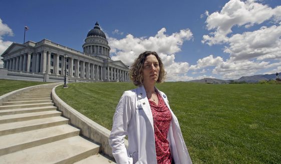 FILE - In this May 10, 2016, file photo, Dr. Leah Torres, an obstetrician-gynecologist, poses for a photo at the Utah State Capitol in Salt Lake City. Torres, a well-known abortion rights activist from Utah has filed a lawsuit on Wednesday, March 13, 2019 against three conservative media publications for defamation, says that online stories spread misinformation that she cut the throats of fetuses during abortions. (AP Photo/Rick Bowmer, File)