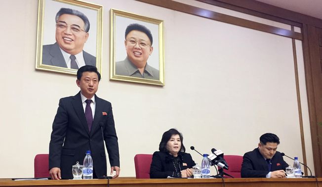 CORRECTS YEAR - North Korean Vice Foreign Minister Choe Son Hui, center, speaks at a gathering for diplomats in Pyongyang, North Korea on Friday, March 15, 2019. North Korean leader Kim Jong Un will soon make a decision on whether to continue diplomatic talks and maintain the country's moratorium on missile launches and nuclear tests, the senior North Korean official said, noting the U.S. threw away a golden opportunity at the recent summit between their leaders. Interpreter is on Choe's right and the man standing is unidentified vice director of foreign ministry’s North America desk. (AP Photo/Eric Talmadge)