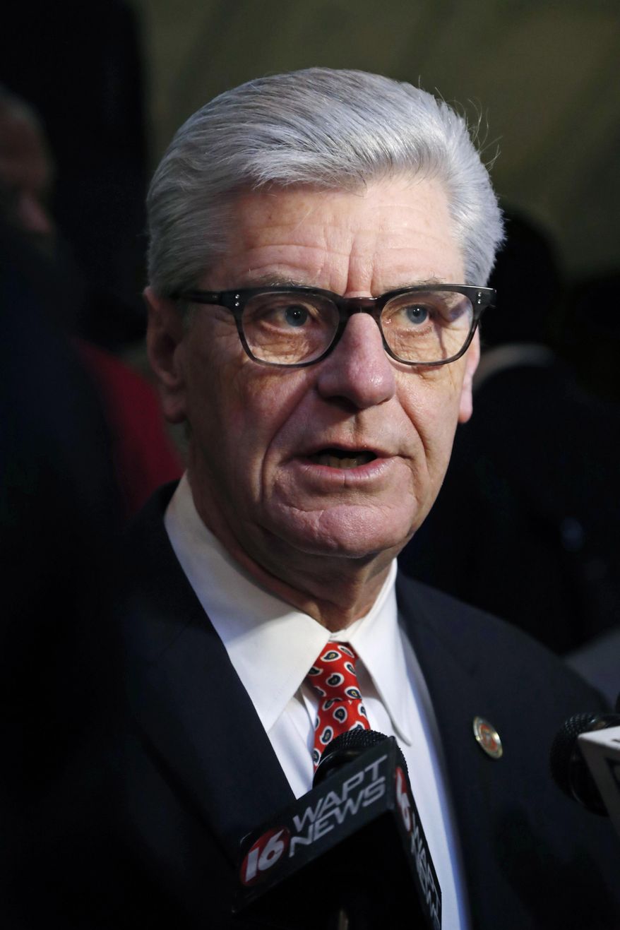 FILE - In this Jan. 20, 2019 file photograph, Gov. Phil Bryant explains to reporters the advantages of passing and signing the Mississippi Broadband Enabling Act, at the Capitol in Jackson, Miss. Mississippi's white Republican governor Bryant and U.S. Rep. Bennie Thompson, the state's only black Democratic congressman are feuding over who should get credit for the home of a slain civil rights leader becoming a national monument. Thompson says he has worked on the issue for 16 years. (AP Photo/Rogelio V. Solis, File)