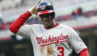 FILE- In this March 30, 2018, file photo, Washington Nationals&#39; Michael A. Taylor runs back to the dugout after scoring in the ninth inning of an opening day baseball game against the Cincinnati Reds in Cincinnati. Taylor favored his left leg as he limped through the clubhouse Friday, March 15, 2019, before heading to have an MRI exam on his sore knee and hip. He said his knee and hip stiffened up after he made a diving catch against Minnesota on Thursday.  (AP Photo/John Minchillo) ** FILE **